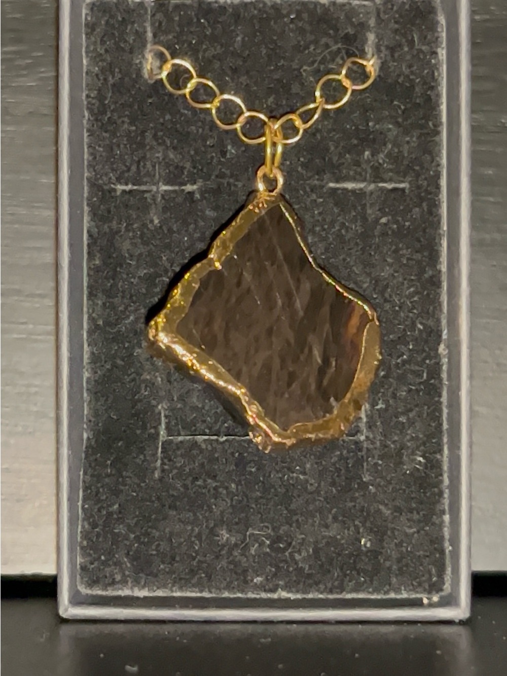 Hand Crafted Black Stone Pendant with Gold Trim